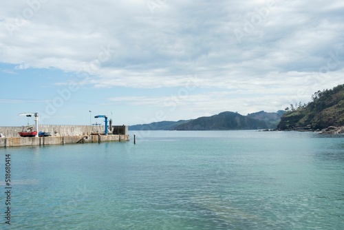 Tazones dock with a waterscape and hills in the background photo