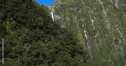 Aerial view of the Sutherland Falls in green mountains of Milford Sound, New Zealand photo