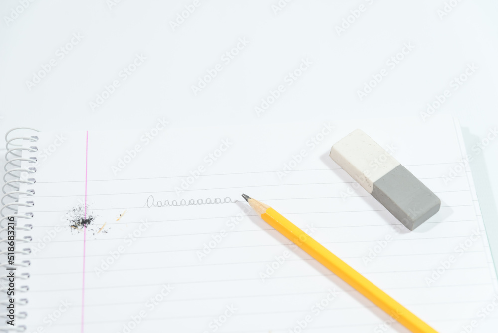 Naklejka premium pencil, eraser and hook on blank sheets