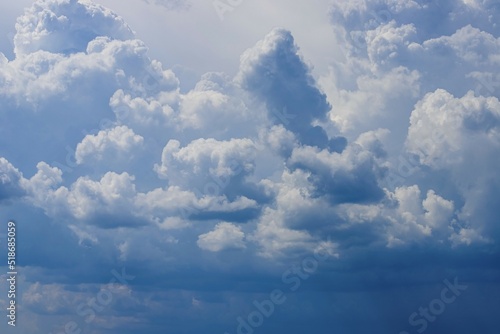 Blue sky with lowering clouds as a background