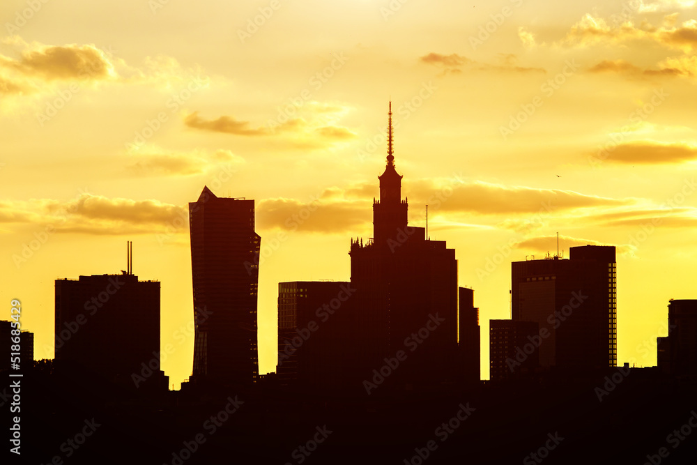 Big city skyline of Warsaw, Poland. Silhouettes Of modern skyscrapers and the famous Palace of Science and Culture.
