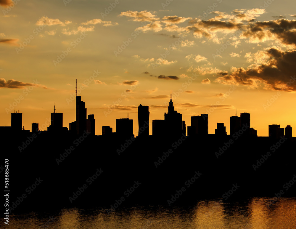 Big city skyline of Warsaw, Poland. Silhouettes Of modern skyscrapers and the famous Palace of Science and Culture.