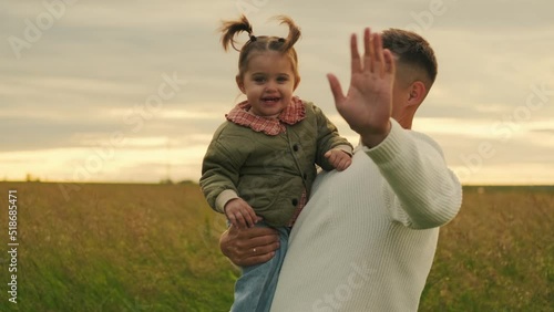Outdoors. Happy joyful young father with his little daughter