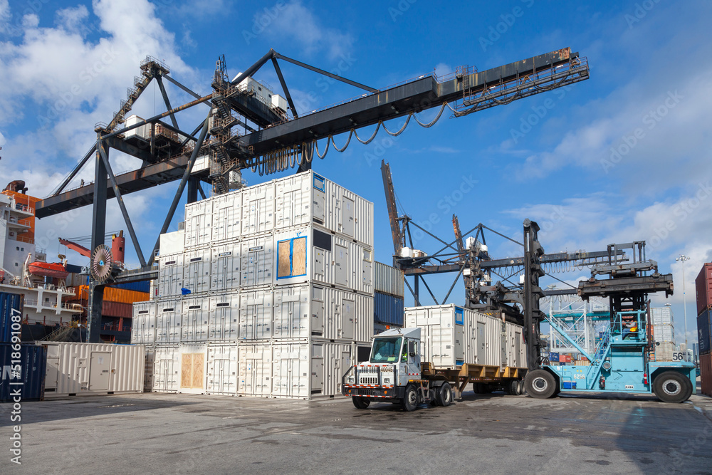 Crane, cargo containers, and forklift at Port of Miami Crane, cargo containers, and forklift at Port of Miami