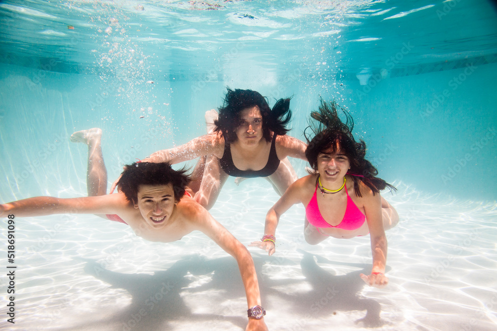 Family portrait underwater in the pool