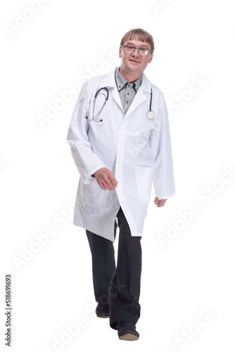 friendly doctor with a stethoscope striding forward .