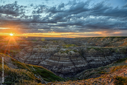 Colorful sunset over the Horsethief Canyon in the Red Deer River Valley, Canadian Badlands on the North Dinosaur Trail, Drumheller, Alberta, Canada photo