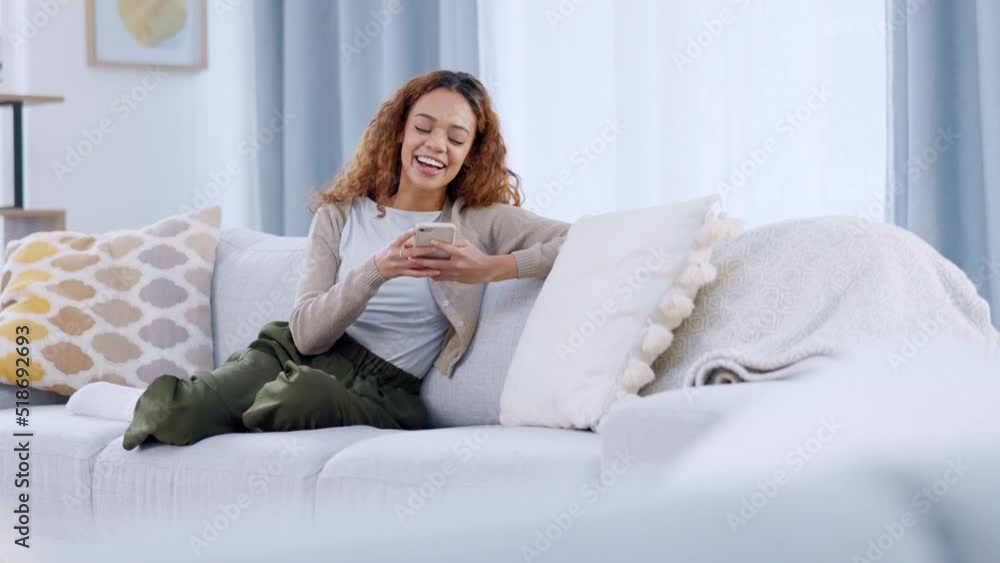 A relaxed woman reading and replying to a funny text on a phone. A lady playing an online mobile game on a sofa. Closeup of laughing female chatting or typing a message on social media. A relaxed woman reading and replying to a funny text on a phone. A lady playing an online mobile game on a sofa. Closeup of laughing female chatting or typing a message on social media.
