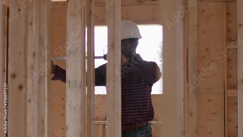 An African American architect working on his dream home. 