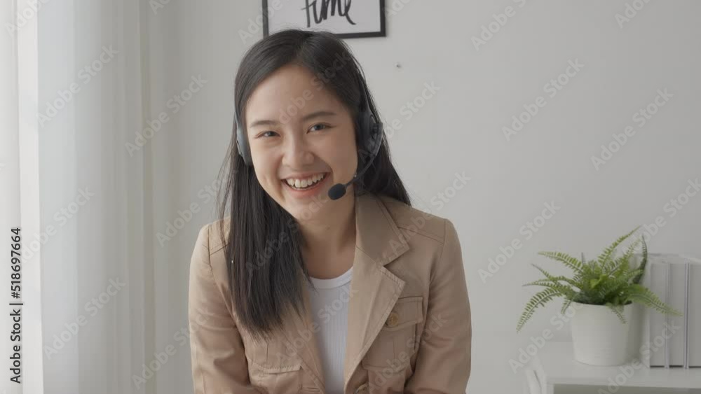 Young asian businesswoman wearing headset video call and presentation for conference online at home, woman meeting and talking for present, one person, business and communication concept. Young asian businesswoman wearing headset video call and presentation for conference online at home, woman meeting and talking for present, one person, business and communication concept.