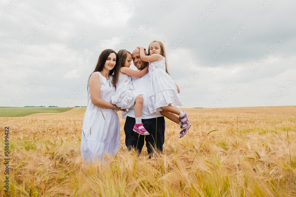 A mother and her daughter are having fun in a wheat field.A cute child is smiling sincerely.Happy smiling kid enjoying vacation in park.Dad and daughters are playing in the wheat field. A mother and her daughter are having fun in a wheat field.A cute child is smiling sincerely.Happy smiling kid enjoying vacation in park.Dad and daughters are playing in the wheat field.