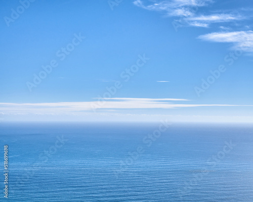 Ocean landscape for copy space, serene and quiet water over a blue horizon. Peaceful and empty sea on a sunny summer day with clouds. Stunning nature scene of water ripples for wallpaper background