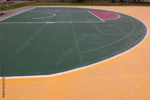 low-angle view of street basketball court with beautiful coloring floor and line shows concept of competition and winning in game for work and business. It is nobody background for sport.
