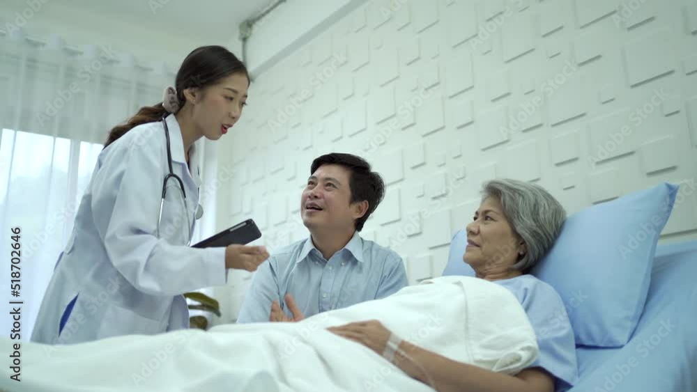 Man taking care his mother while recovery in the hospital and doctor comes to talk to patient. Man taking care his mother while recovery in the hospital and doctor comes to talk to patient.