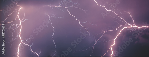 Lightning flash on dark background, banner design. thunderstorm . The cloud grounds lightning during a thunderstorm. Natural natural unique background.