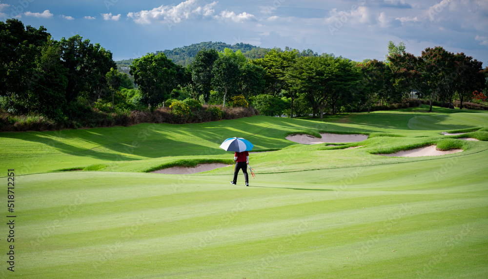 Fototapeta premium Professional golfer teeing golf in golf tournament competition at golf course for winner 