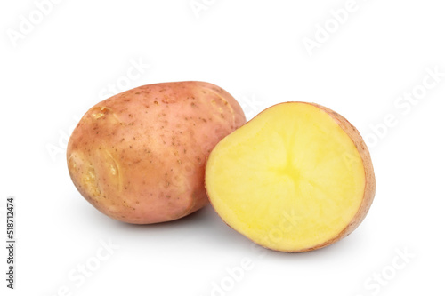 Raw potato with half of raw potato on a white.