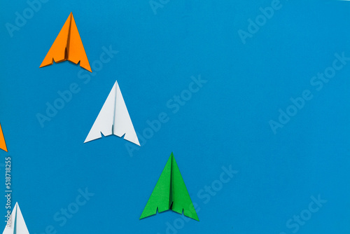 Indian tricolor paper rocket crafts isolated on blue background. Space for text. 