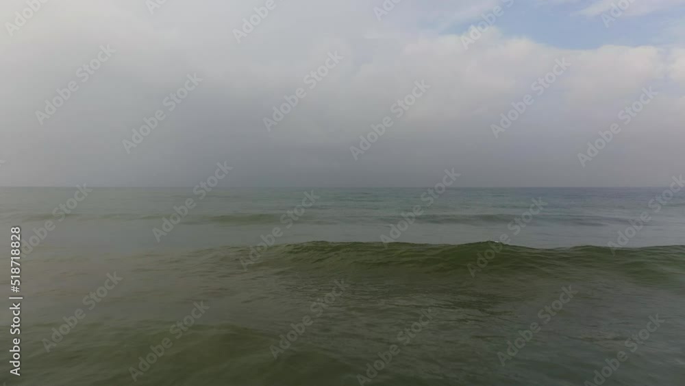 Aerial view of surface of blue ocean with waves and sky with cloud. Water cloud horizon background. Aerial view of surface of blue ocean with waves and sky with cloud. Water cloud horizon background.