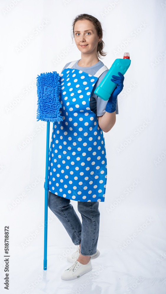 european housewife in kitchen apron, jeans on white background, full length portrait. woman with mop cleaning european housewife in kitchen apron, jeans on white background, full length portrait. woman with mop cleaning
