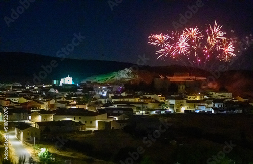fireworks over village castle at night