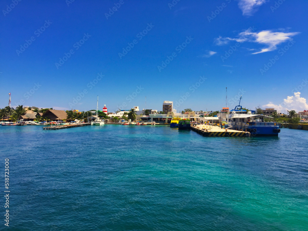 Harbor port of Isla Mujeres Island with buildings and boats