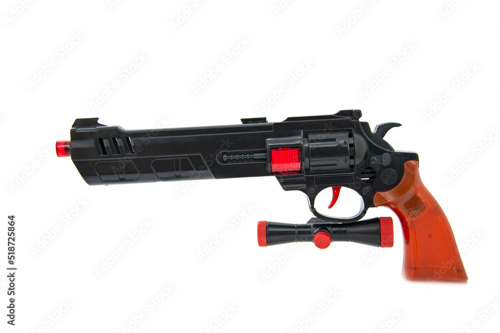 Toy gun black pistol for fun isolated on the white background Toy gun black pistol for fun isolated on the white background