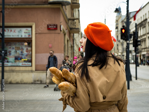 A girl in a coat and beret in the French style