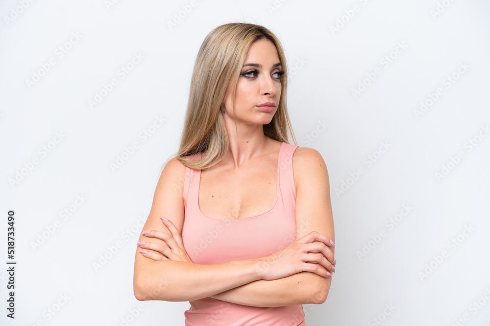 Pretty blonde woman isolated on white background keeping the arms crossed Pretty blonde woman isolated on white background keeping the arms crossed
