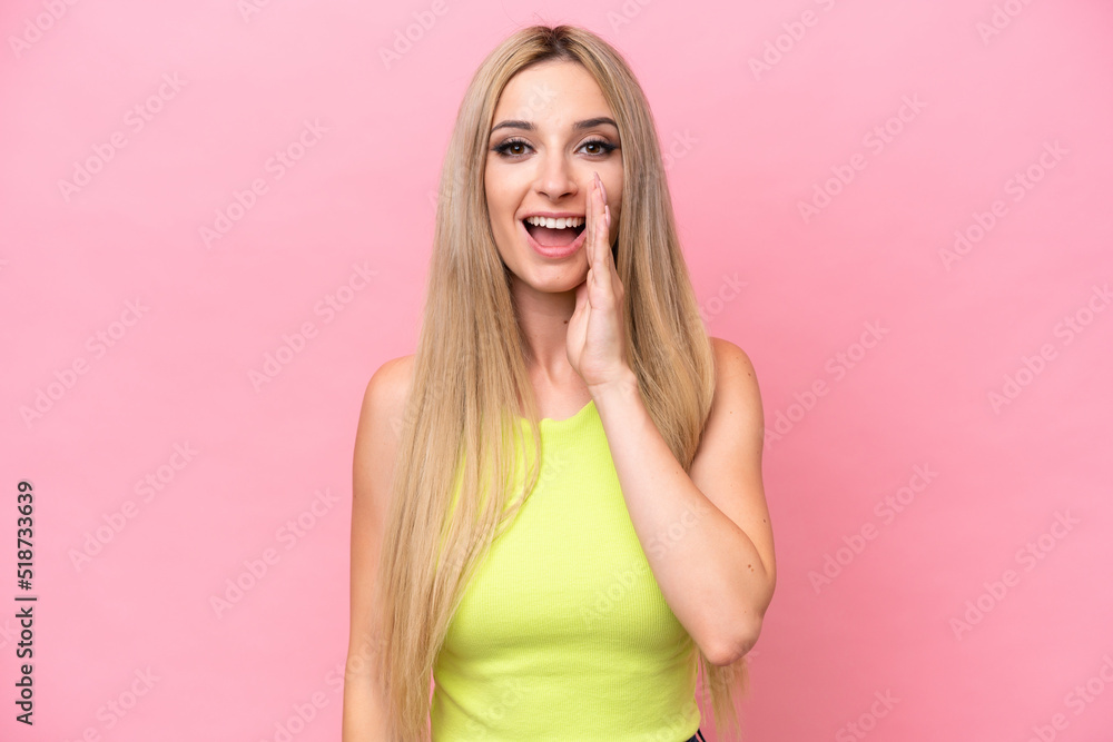 Pretty blonde woman isolated on pink background with surprise and shocked facial expression Pretty blonde woman isolated on pink background with surprise and shocked facial expression