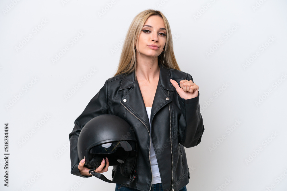 Pretty blonde woman with a motorcycle helmet isolated on white background proud and self-satisfied Pretty blonde woman with a motorcycle helmet isolated on white background proud and self-satisfied