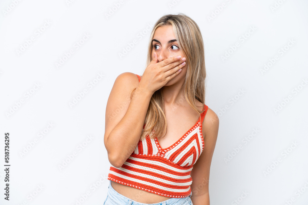 Young caucasian woman isolated on white background doing surprise gesture while looking to the side Young caucasian woman isolated on white background doing surprise gesture while looking to the side
