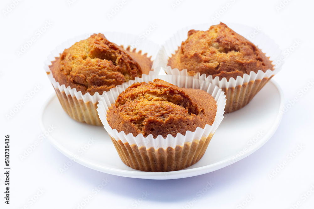Sweet Banana muffins in white plate isolated on white background.