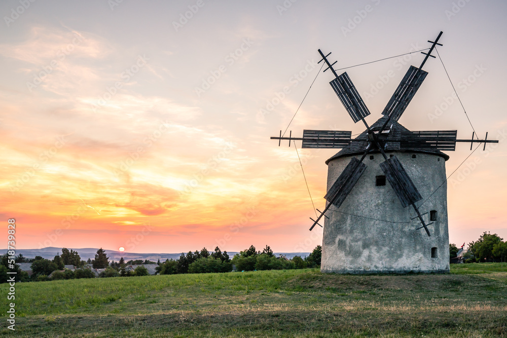 The windmills of Tés, main attraction of Tés, at Lake Balaton in the sunset The windmills of Tés, main attraction of Tés, at Lake Balaton in the sunset