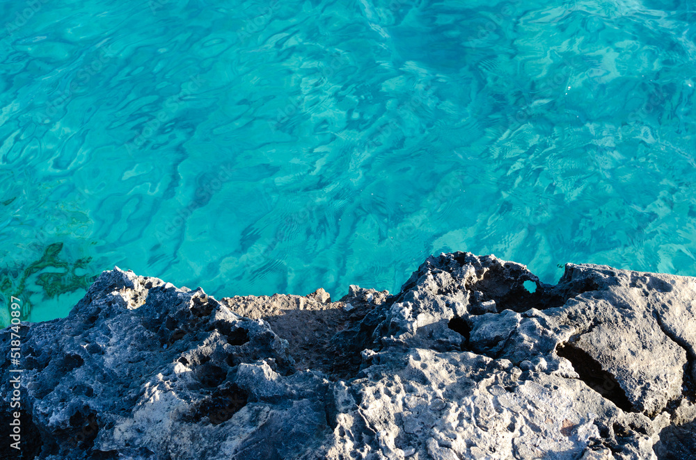 rock textures and turquoise sea