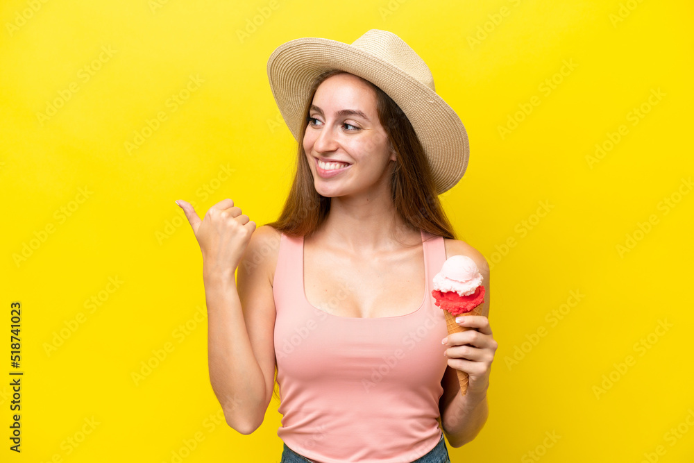 Young caucasian with a cornet ice cream isolated on yellow background pointing to the side to present a product Young caucasian with a cornet ice cream isolated on yellow background pointing to the side to present a product