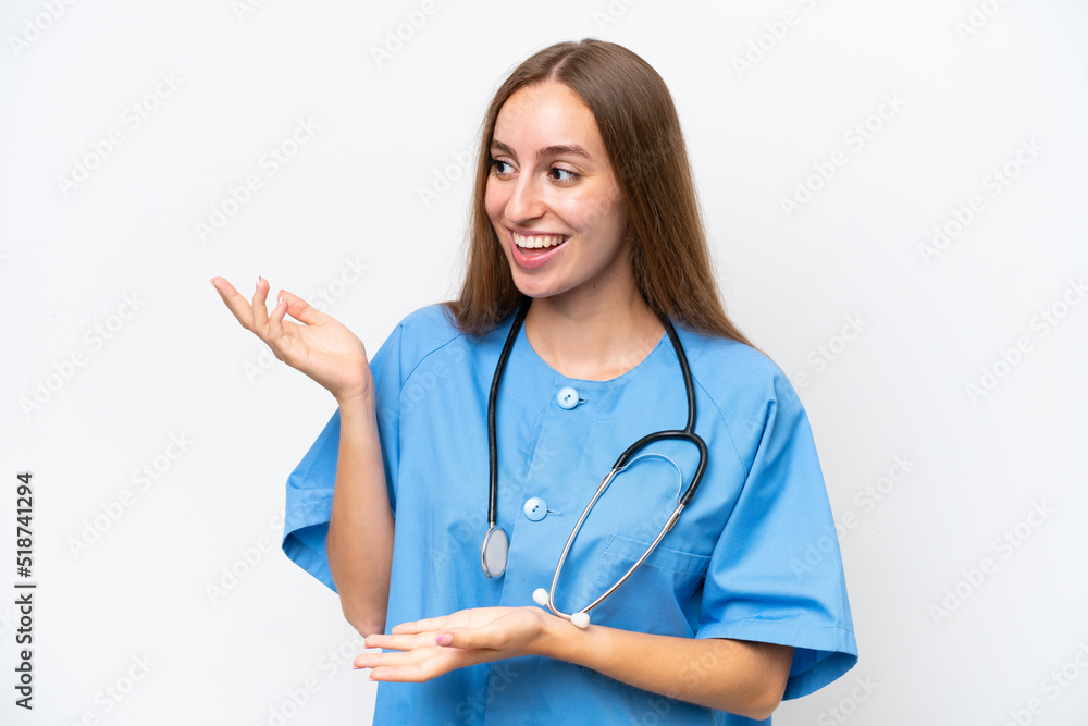 Young nurse woman over isolated on white background with surprise facial expression Young nurse woman over isolated on white background with surprise facial expression