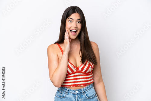 Young Brazilian woman isolated on white background with surprise and shocked facial expression © luismolinero