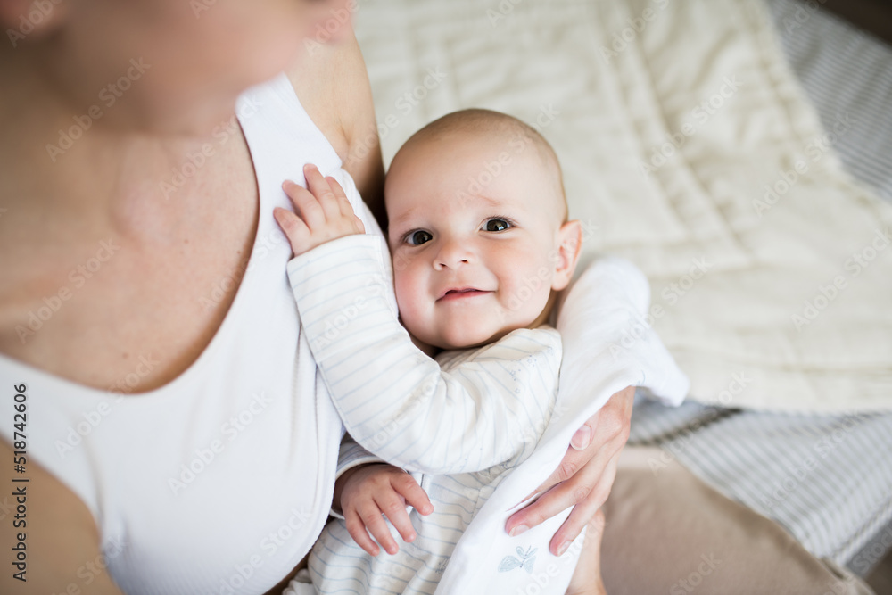 close-up portrait of a baby who sucks milk from the mother's breast. A woman is breastfeeding her little son in her arms. selective Focus, close-up portrait of a baby who sucks milk from the mother's breast. A woman is breastfeeding her little son in her arms. selective Focus,