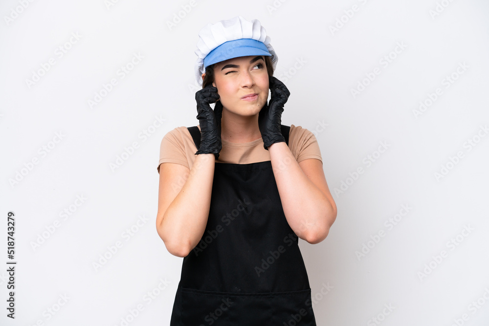 Fishmonger brazilian woman wearing an apron isolated on white background frustrated and covering ears Fishmonger brazilian woman wearing an apron isolated on white background frustrated and covering ears