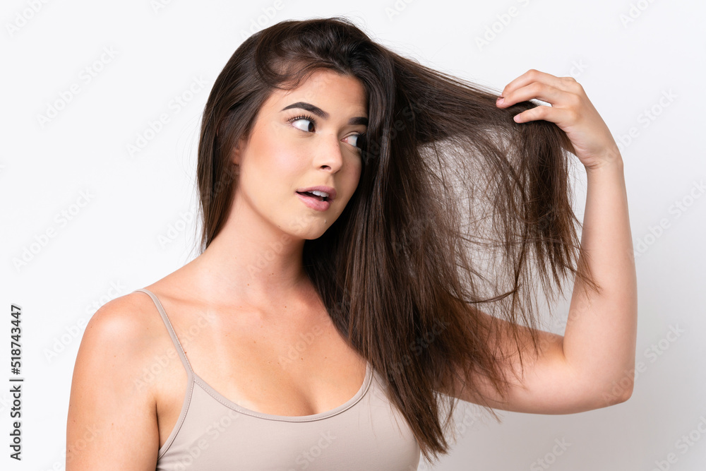Young Brazilian woman isolated on white background with tangled hair. Close up portrait Young Brazilian woman isolated on white background with tangled hair. Close up portrait