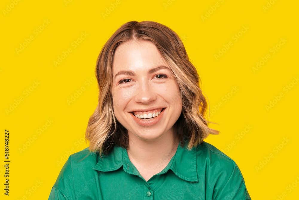 A close up photo of a beautiful woman smiling at the camera A close up photo of a beautiful woman smiling at the camera
