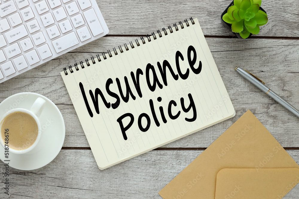 insurance policy form on notepad with text on table showing risk concept. Life Health, car, travel insurance policy form on notepad with text on table showing risk concept. Life Health, car, travel