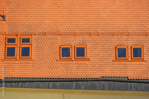 Roof of an historic house in center of Telc city with an roof windows.