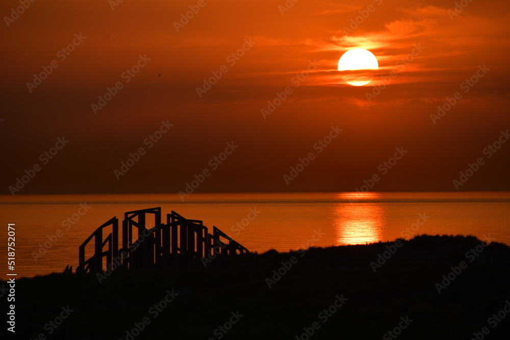 Stunning deep orange sunset over Maasvlakte, Netherlands