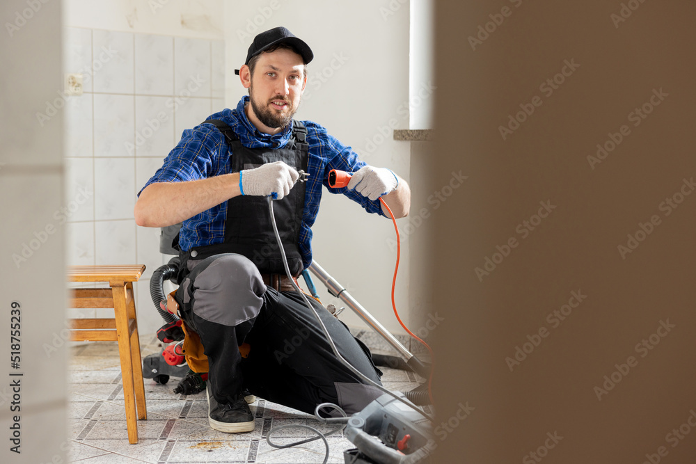 Connecting cables with a plug, extension cord plugging in construction