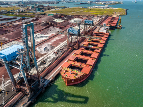 Cranes Unloading Cargo from a Bulk Carrier Ship at Port