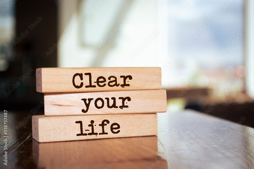 Wooden blocks with words 'Clear Your Life'.