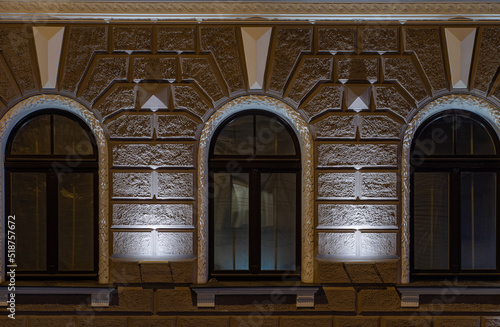 Modern illuminated residential building. Detail of exterior.