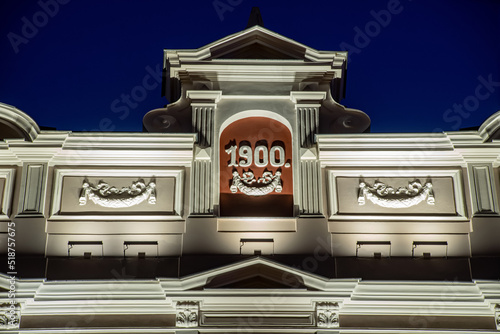 Modern illuminated residential building. Detail of exterior.